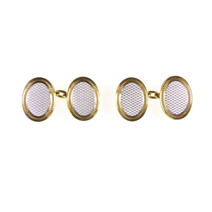 Pair of early 20th century platinum and 18ct gold oval cufflinks